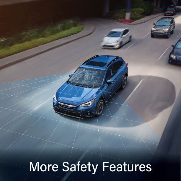 A Subaru Crosstrek in blue with the words &ldquo;More Safety Features&ldquo;. | Subaru of Naples in Naples FL