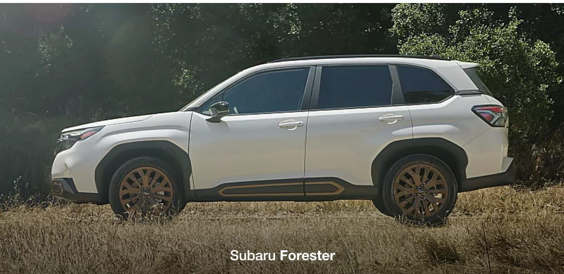 White Subaru Forester driving off-road through a grassy landscape, shown in side profile.