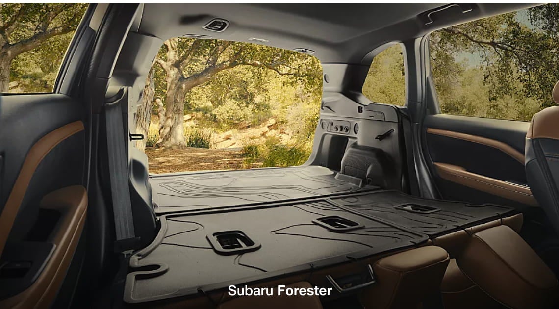 Subaru Forester cargo area with the rear seats folded down, showcasing a spacious flat load floor.