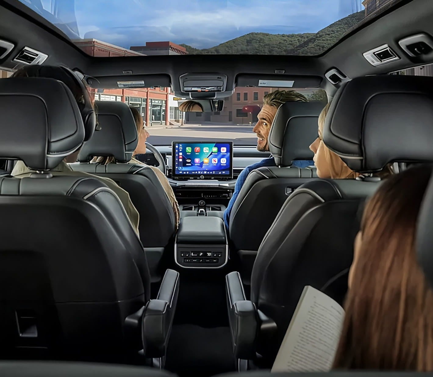 Interior view of the 2028 Subaru Getaway with three-row seating, panoramic glass roof, and a large center touchscreen.