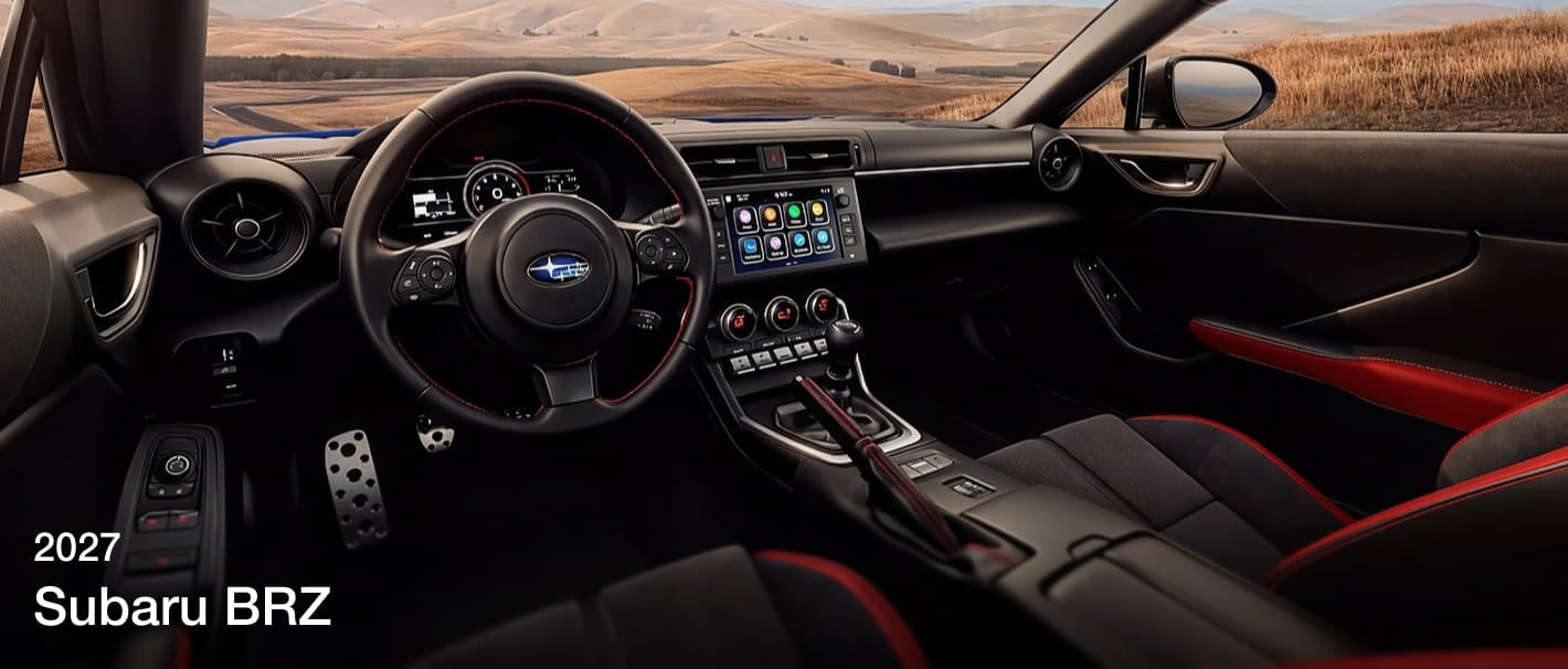 2027 Subaru BRZ interior featuring sport seats with red accents, digital displays, and infotainment touchscreen.